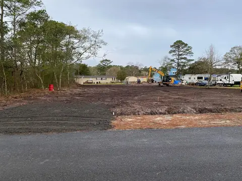 Lot cleared and leveled with equipment staged — Coastal Clearing & Debris, Brunswick County NC