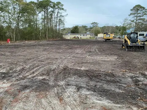 Building pad shaped out with the crew staged on site — Coastal Clearing & Debris, Brunswick County NC