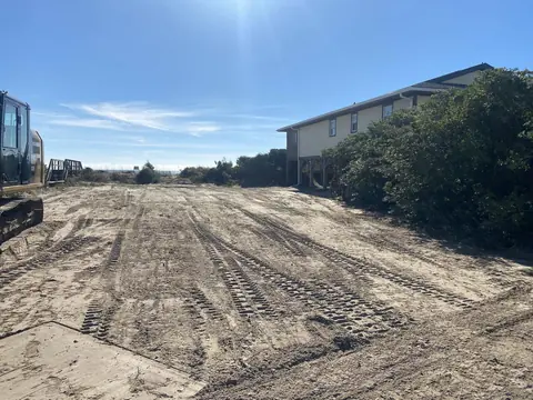 Pad worked in tight beside an existing raised home — Coastal Clearing & Debris, Brunswick County NC