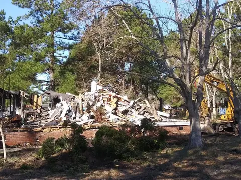 Slab cleared with the last of the material stacked — Coastal Clearing & Debris, Brunswick County NC