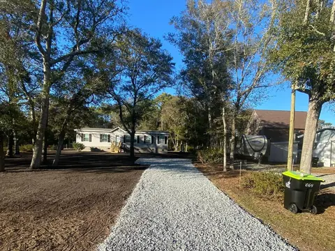 Washed stone laid over a shaped base — Coastal Clearing & Debris, Brunswick County NC