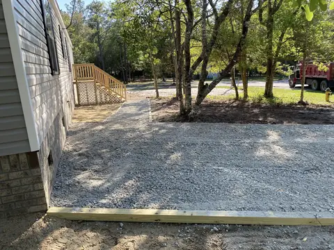Parking apron widened out beside the house — Coastal Clearing & Debris, Brunswick County NC