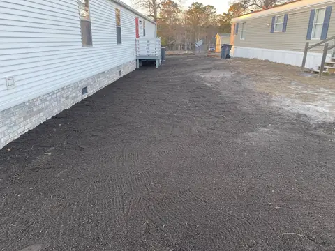 Access strip cut in alongside the home — Coastal Clearing & Debris, Brunswick County NC