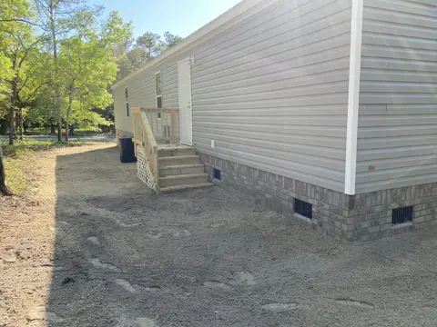 Yard brought back to grade after the work — Coastal Clearing & Debris, Brunswick County NC